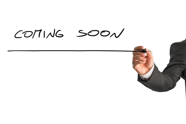 Man writing Coming soon on a virtual screen — Stock Photo, Image