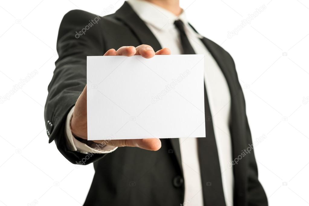 Business man holding blank card with copyspace ready for your te