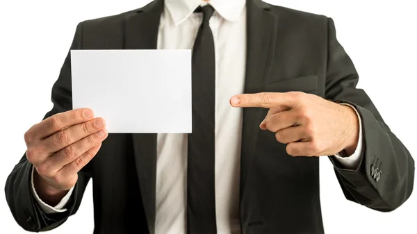 Businessman pointing to a blank card — Stock Photo, Image