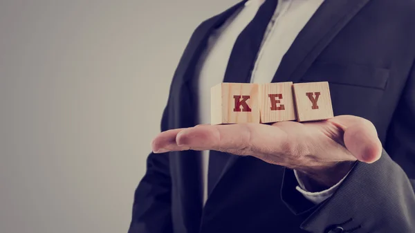 Three wooden cubes displaying word Key — Stock Photo, Image