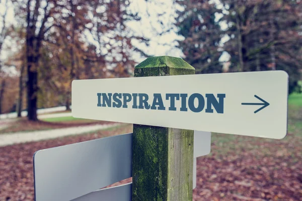 Inspiration signboard on a wooden post with a right pointing arr — Stock Photo, Image