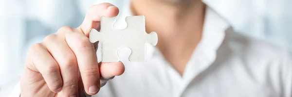 Businessman Holding Jigsaw Puzzle Piece — Stock Photo, Image