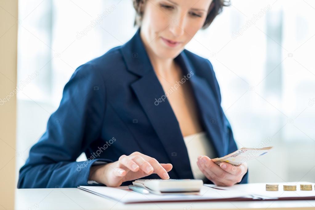 Young female bank officer at work