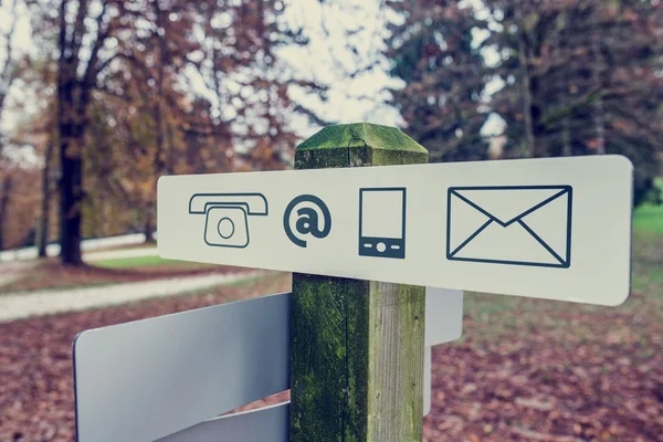 Contact signboard in an autumn park — Stock Photo, Image