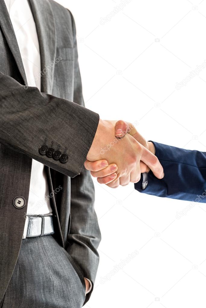 Closeup of male and female business partners shaking hands