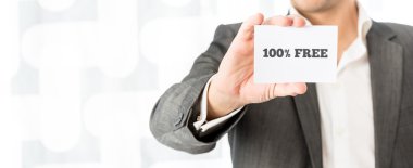 Salesman showing a white business card with hundred percent free sign clipart