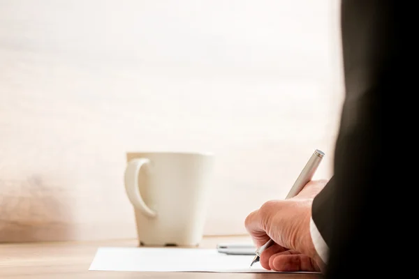 Businessman signing a document or contract — Stock Photo, Image