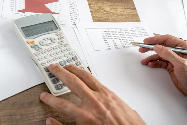 Closeup of male financial adviser calculating numbers — Stock Photo, Image