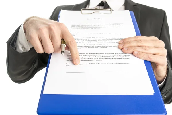 Mid section of businessman pointing at document — Stok fotoğraf