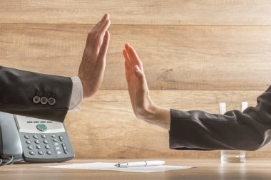 Two hands reach to hi-five