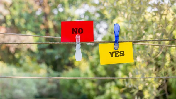 Paper with Yes and No Texts Clipped on a String — 图库照片