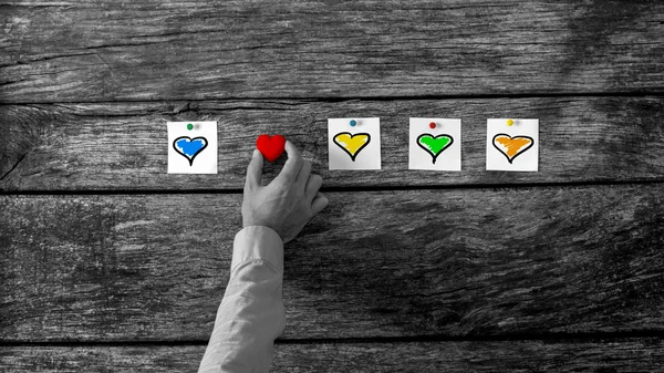 Man Arranging Hearts in Horizontal on the Table — Stock Photo, Image