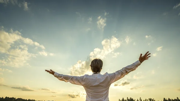 Successful man in elegant white shirt standing with his back to — Stock Photo, Image