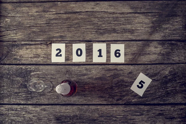 Top view of 2016 sign and a bottle of champagne with crystal gla — Stock Photo, Image