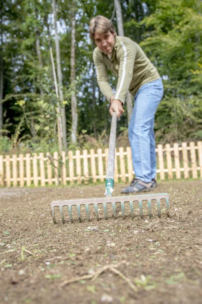 Man doing yard work in his backyard