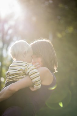 Beautiful loving moment between a young mother and her baby son