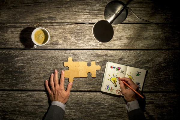 Top view of businessman working and brainstorming  at his wooden — Zdjęcie stockowe