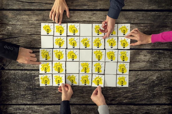 Top view of a group of many scientists each holding a card with — Stock Photo, Image