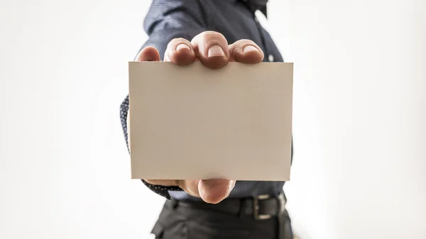 Closeup of a man showing a blank white business card — Stock Photo, Image