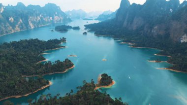 bird flight. top view. Coastal And Oceanic Landforms. Water Resources. Watercourse. Geological Phenomenon. Nature Reserve. Island. Rocks off the coast of the ocean. Coastal And Oceanic Landforms. Water Resources. Watercourse. Guadalest reservoir on a