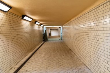 Wroclaw, Poland - February 20 2020 Long tunnel with white tiles under train platforms