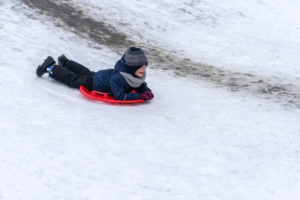 Little Boy Rides Sled Winter Slide Winter Holidays — Stock Photo, Image