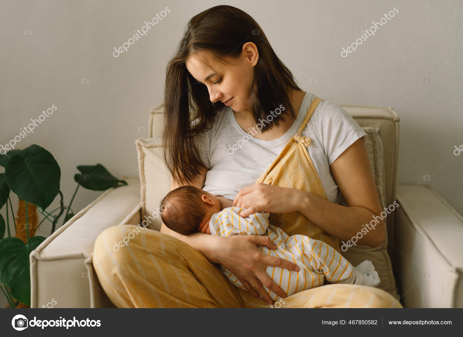 Newborn baby boy sucking milk from mothers breast. Portrait of mom and  breastfeeding baby. Stock Photo by ©Nastyaofly 467850582