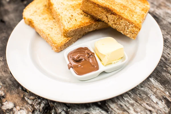 Perfect breakfast. Toast with butter and chocolate paste