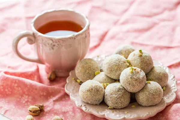Homemade coconut balls decorated with little pink flowers — Stock Photo, Image