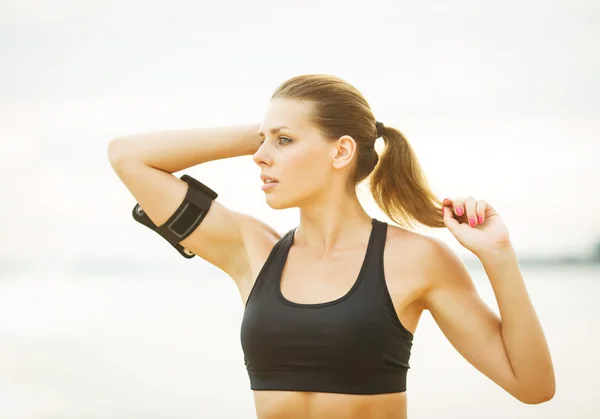 Beautiful woman running on the beach — Stock Photo, Image