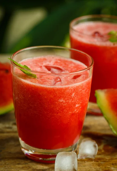 Watermelon juice on a wooden table — Stock Photo, Image