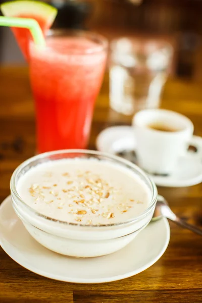 Oatmeal with juice and coffee — Stok fotoğraf