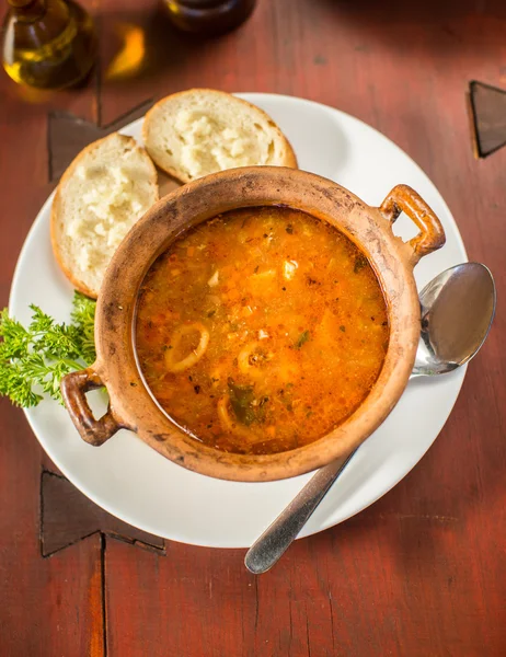 Fish soup with bread and garlic — Stock Photo, Image