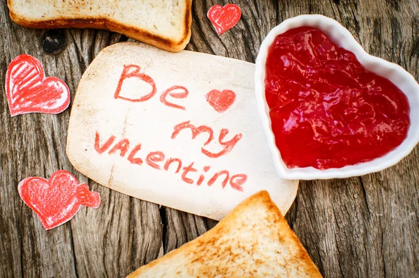 Toast with strawberry jam. Be My Valentine white message card wi