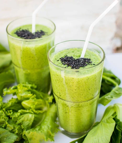 Fresh green smoothie with banana and spinach with heart of sesam — Stock Image Fresh green smoothie with banana and spinach with heart of sesam Stock Image