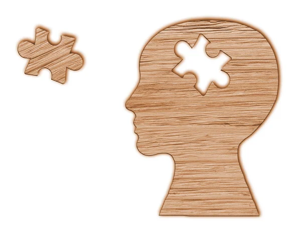 Menschliche Kopf-Silhouette mit ausgeschnittenem Puzzle — Stockfoto