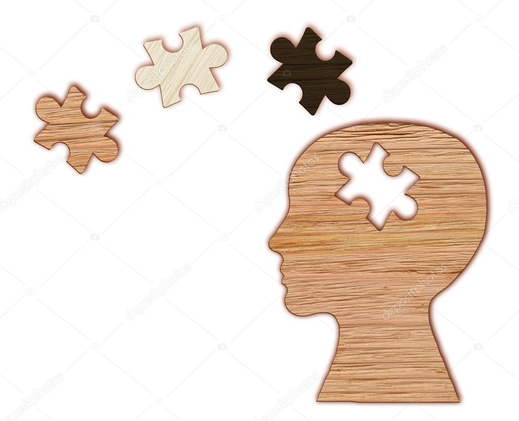 Mental health symbol. Human head silhouette with a puzzle