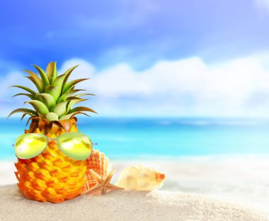 Pineapple with sunglasses in the beach. Summer beach concept.