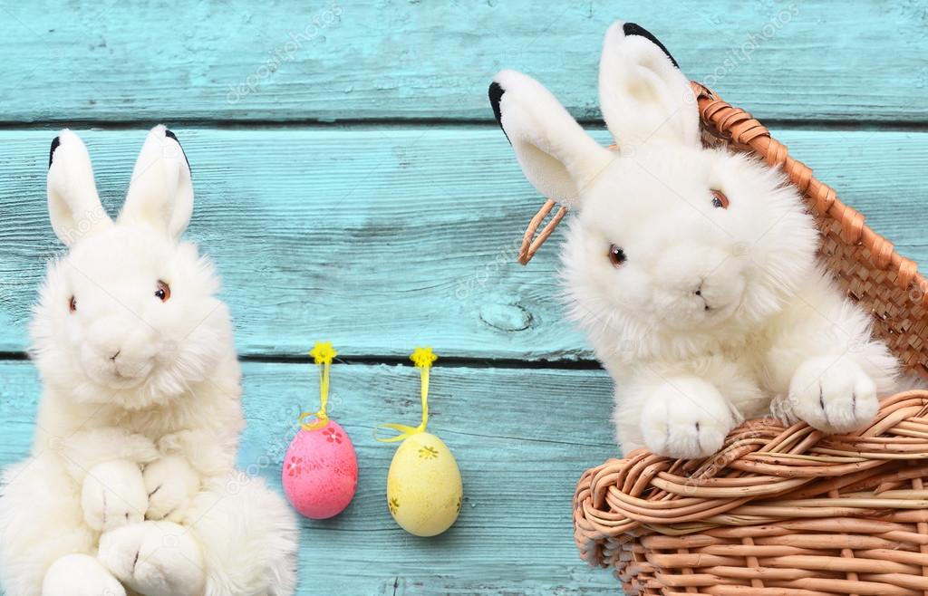 rabbits in the basket with Easter eggs
