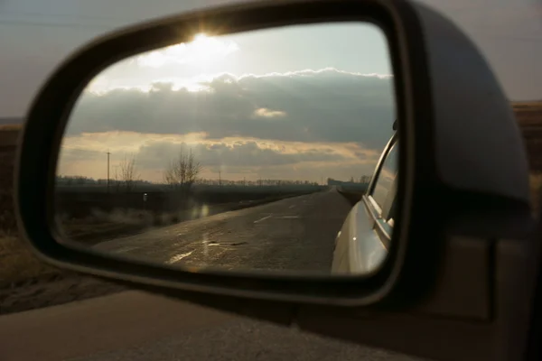 The reflection in the rearview mirror Stock Picture