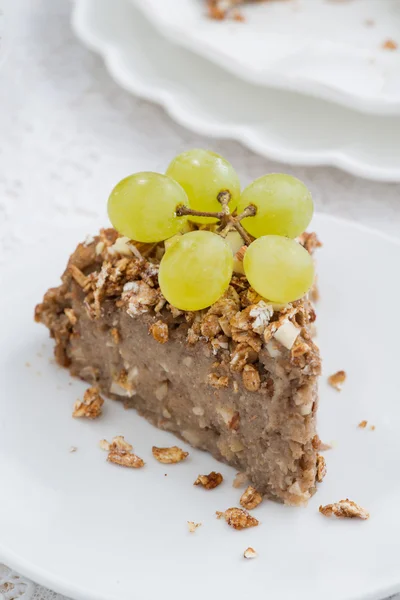 Piece of nut pie with grapes, top view — Stock Photo, Image