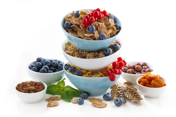 Assortment of breakfast cereal, dried fruit and fresh berries — Stock Photo, Image