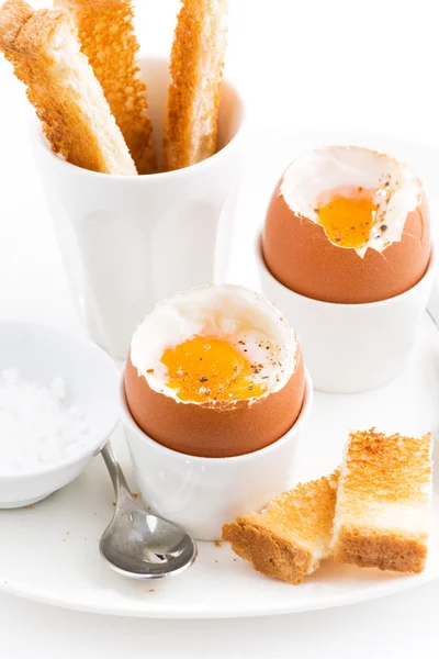 Boiled eggs and crispy toast for breakfast, closeup vertical — Stock Photo, Image