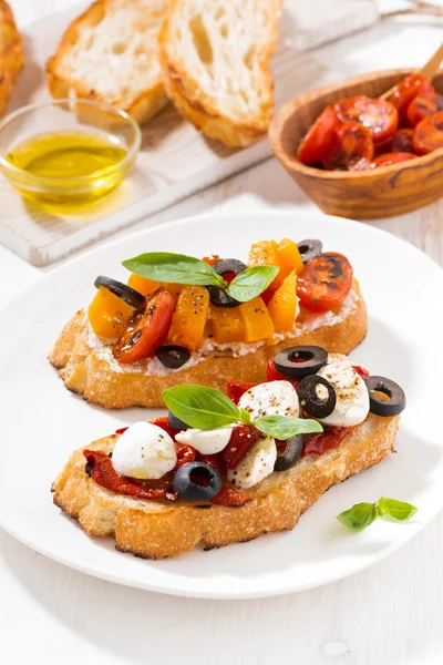 Bruschettas with tomatoes and mozzarella, top view vertical — Stock Photo, Image