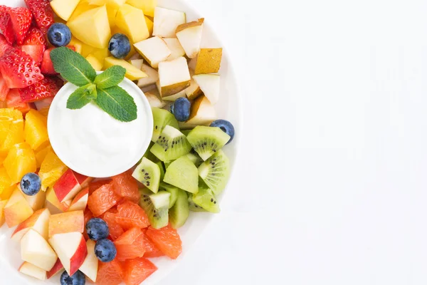 Fresh ingredients for fruit salad and natural yoghurt on plate — Stock Photo, Image