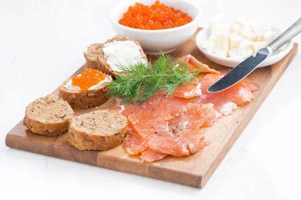 Salted salmon, red caviar, toast and butter — Stock Photo, Image