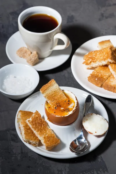 Soft boiled egg, toasts and cup of coffee for breakfast — Stock Photo, Image