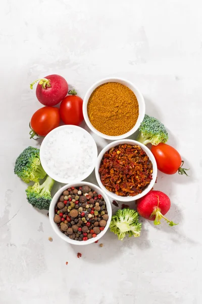 Assortment of pepper, salt, spices and fresh vegetables — Stock Photo, Image