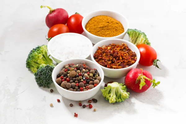Assortment of pepper, salt, spices and fresh vegetables — Stock Photo, Image
