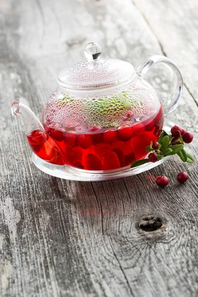 Berry tea in glass teapot — Stock Photo, Image